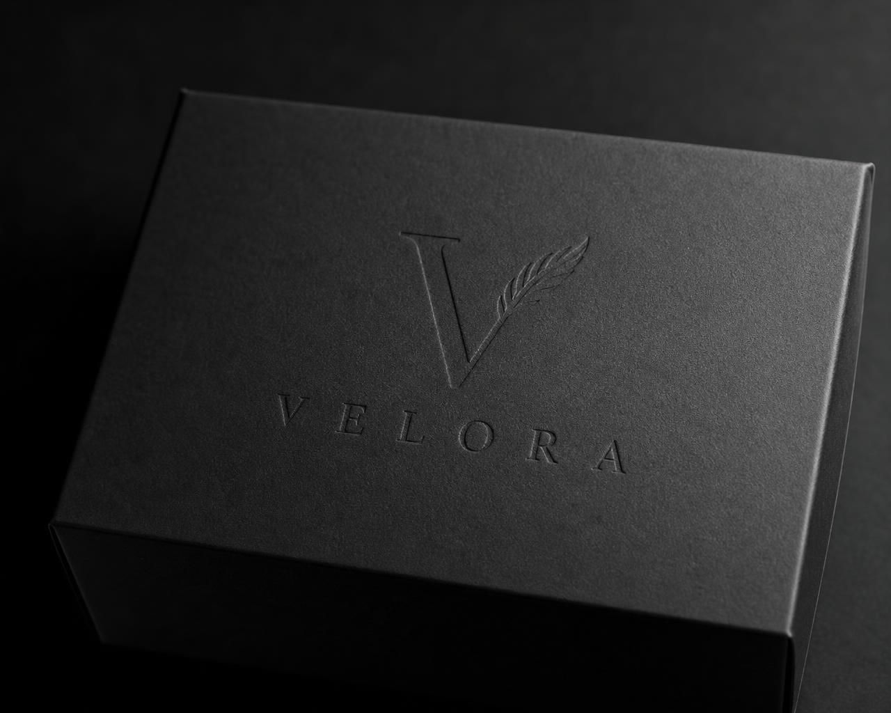 Velora Atelier case, blind-embossed with the V mark